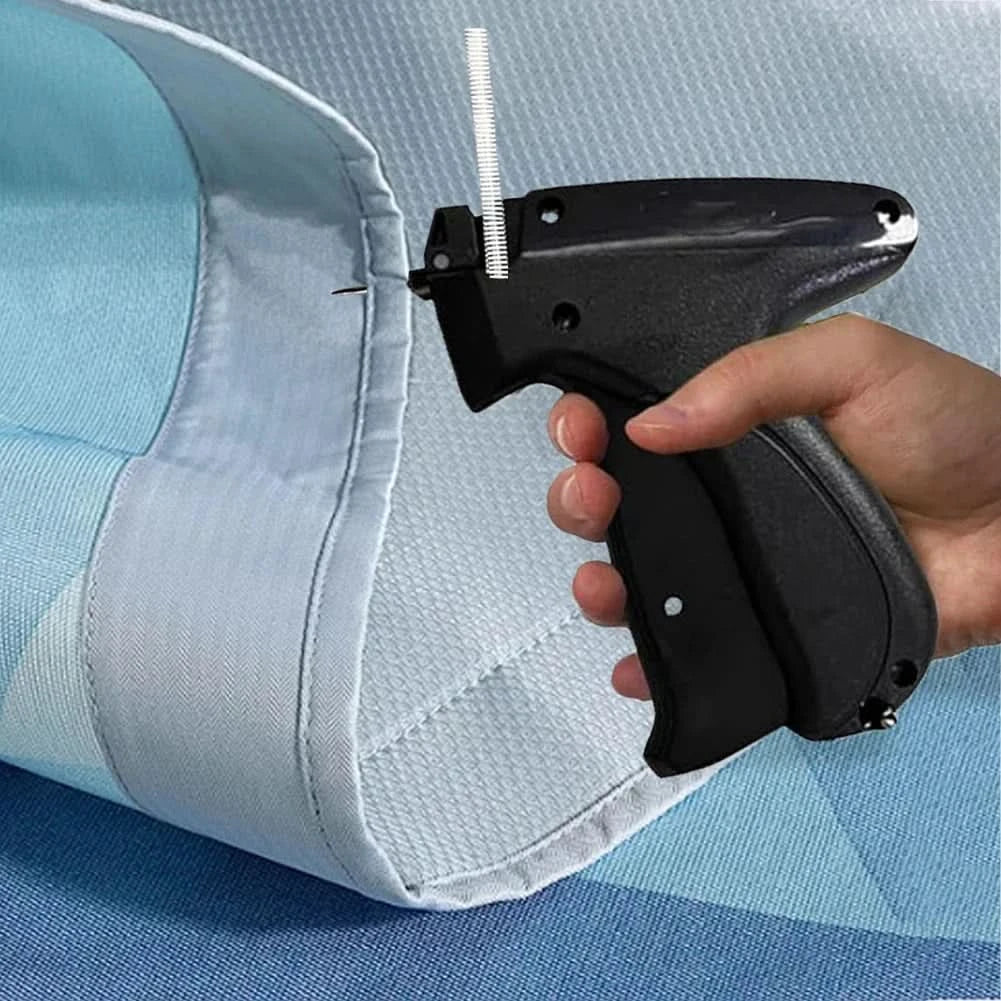 Quick sewing gun for attaching labels and hems 